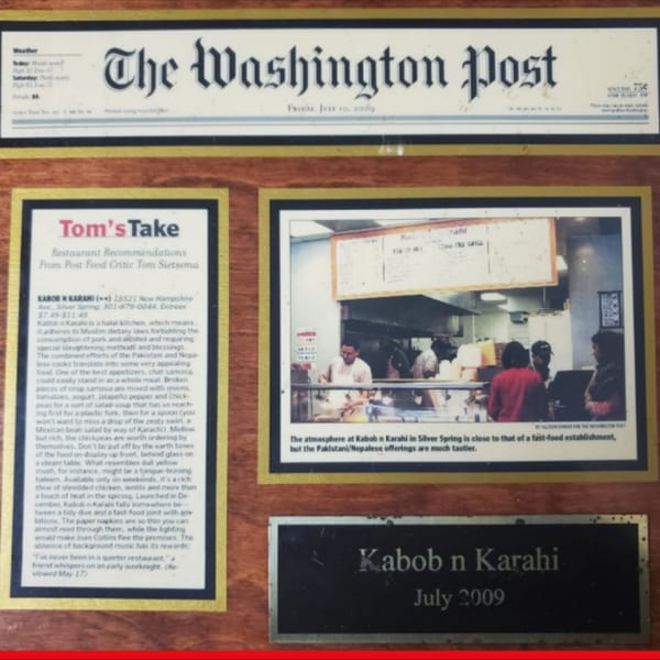 Framed newspaper clippings from The Washington Post about Kabob N Karahi restaurant.